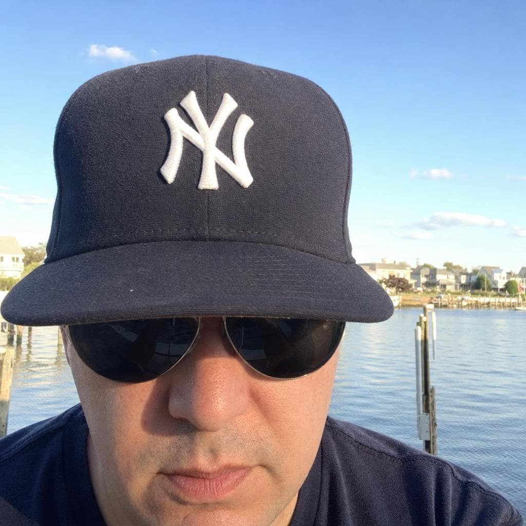 Bad example — sunglasses and hat obscure the face